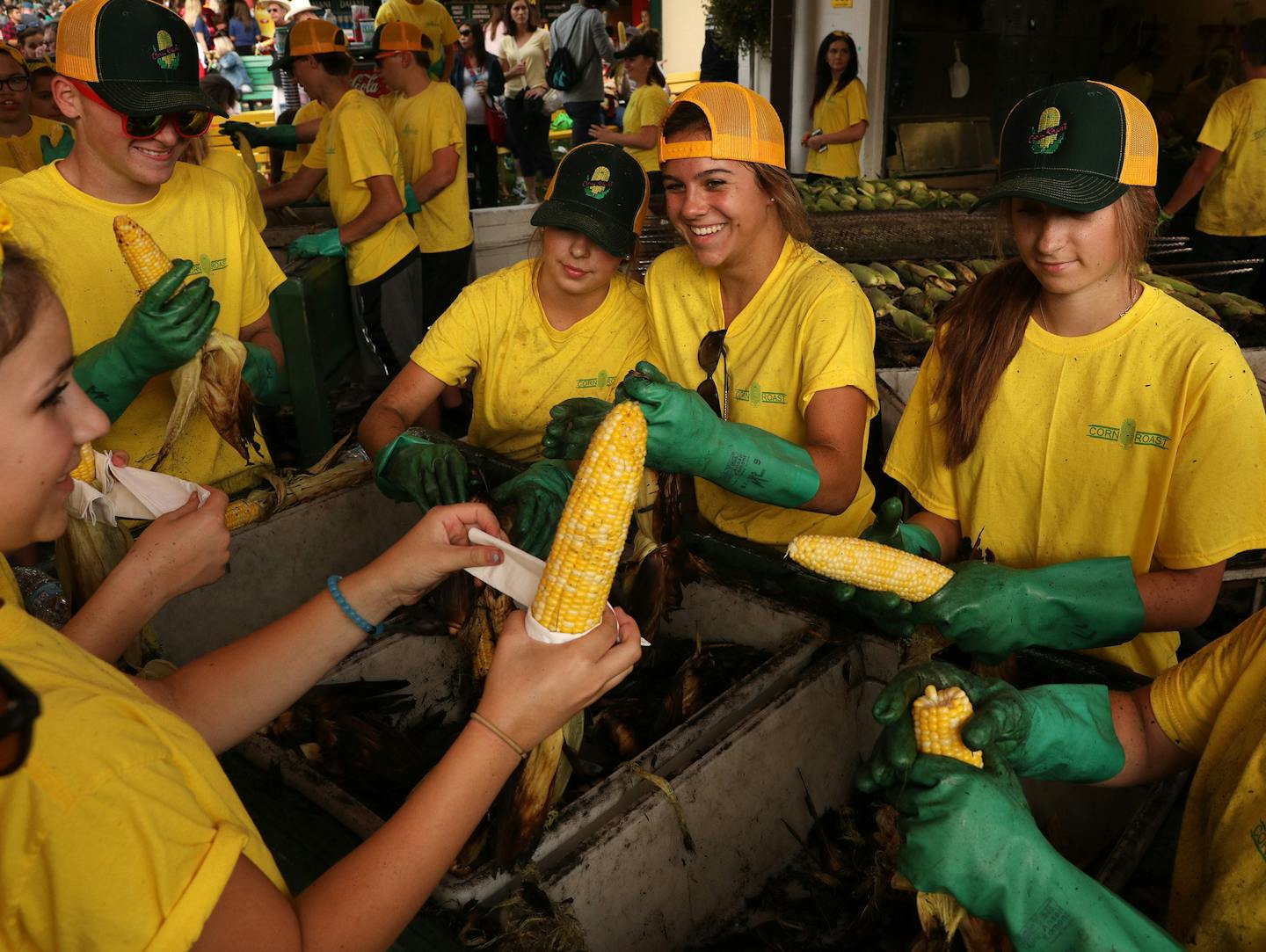 Workers at the Corn Roast shucked ears of corn for patrons. ] ANTHONY SOUFFLE &#xef; anthony.souffle@startribune.com Photos from opening day at the Minnesota State Fair Thursday, Aug. 24, 2017 in St. Paul, Minn.