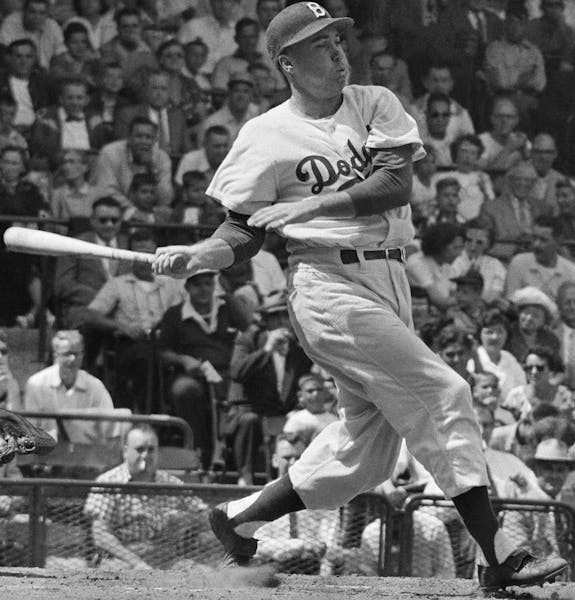 FILE - In this photo from about 1950, Brooklyn Dodgers' Duke Snider bats in a baseball game. Snider, 84, died early Sunday, Feb. 27, 2011, of what the