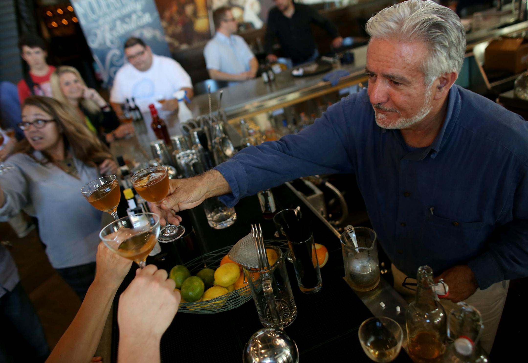 Dale "King Cocktail" DeGroff raised a glass with a bunch local bartenders. ] (KYNDELL HARKNESS/STAR TRIBUNE) kyndell.harkness@startribune.com During a cocktail seminar at Coup d'Etat in Minneapolis Min., Tuesday, August, 26, 2014.