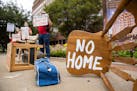 Protesters placed furniture and rallied outside the Dallas office of Sen. John Cornyn, R-Texas, in September "to show him the reality of the eviction 