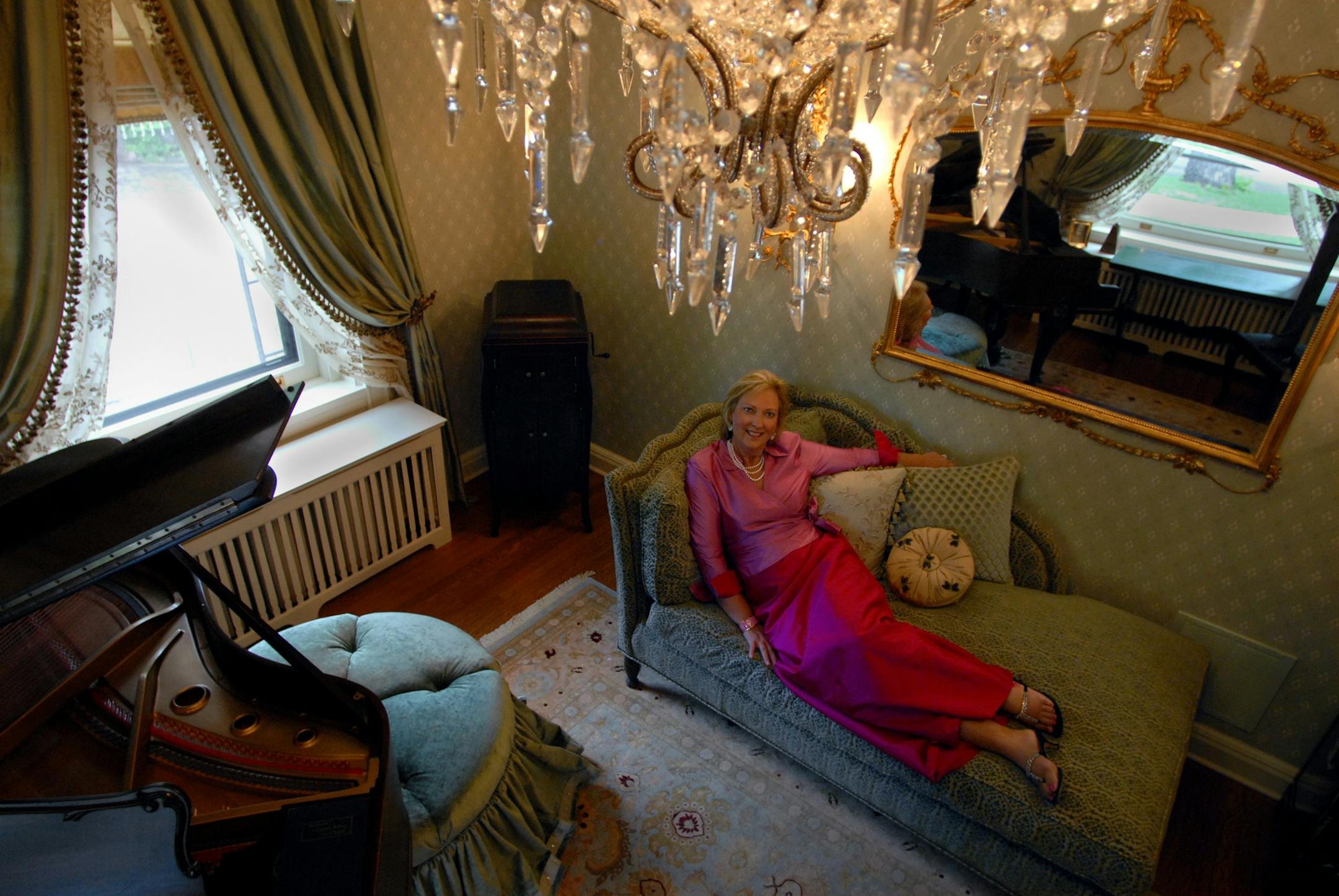 Nancy Nicholson reclined in the front music room of the Summit Avenue mansion she and her husband, Dick, own and will rent out during the Republican National Convention.