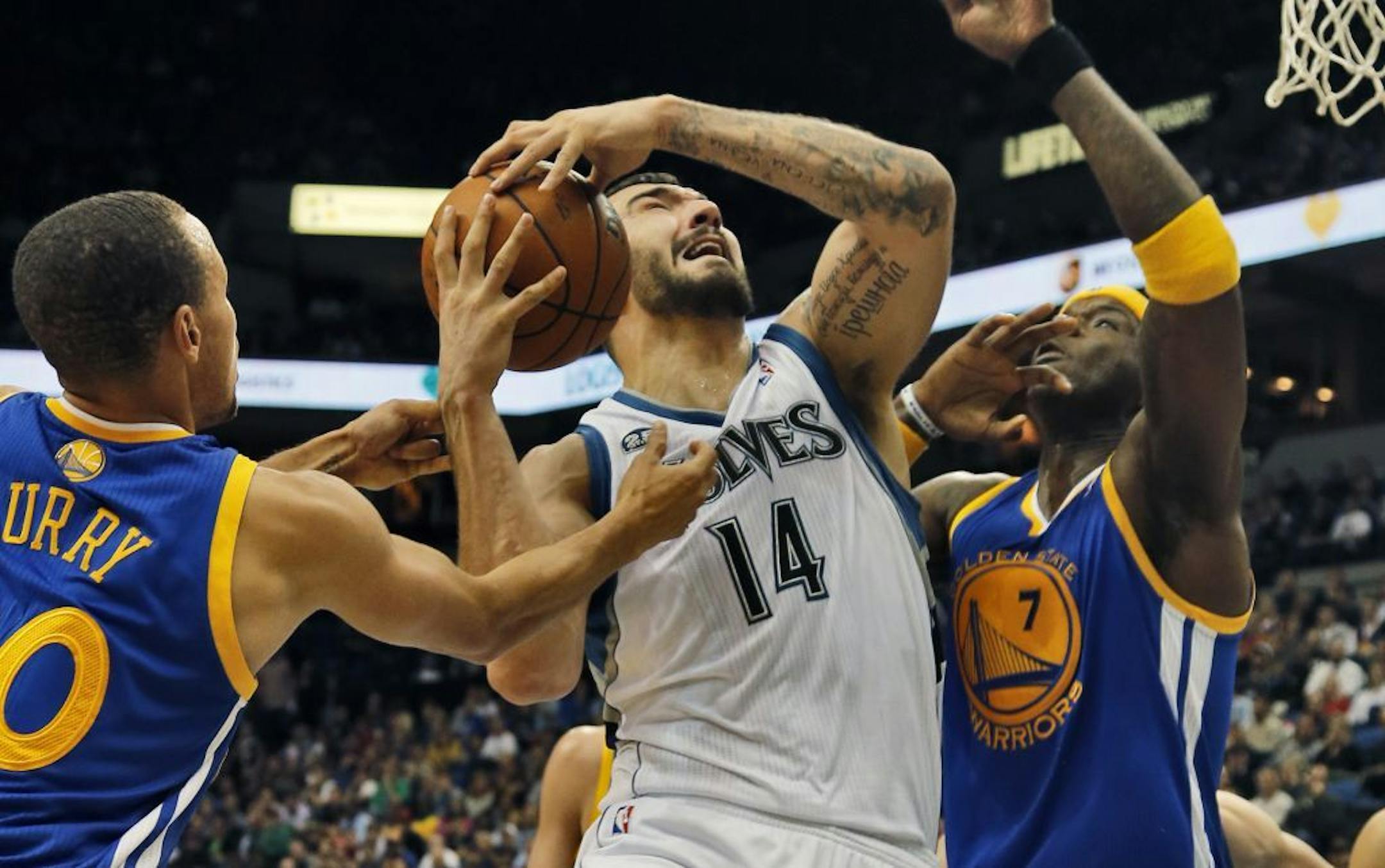 Timberwolves vs. Golden State Warriors. wolves Nikola Pekovic (14) was fouled as he went up for a layup. (MARLIN LEVISON/STARTRIBUNE