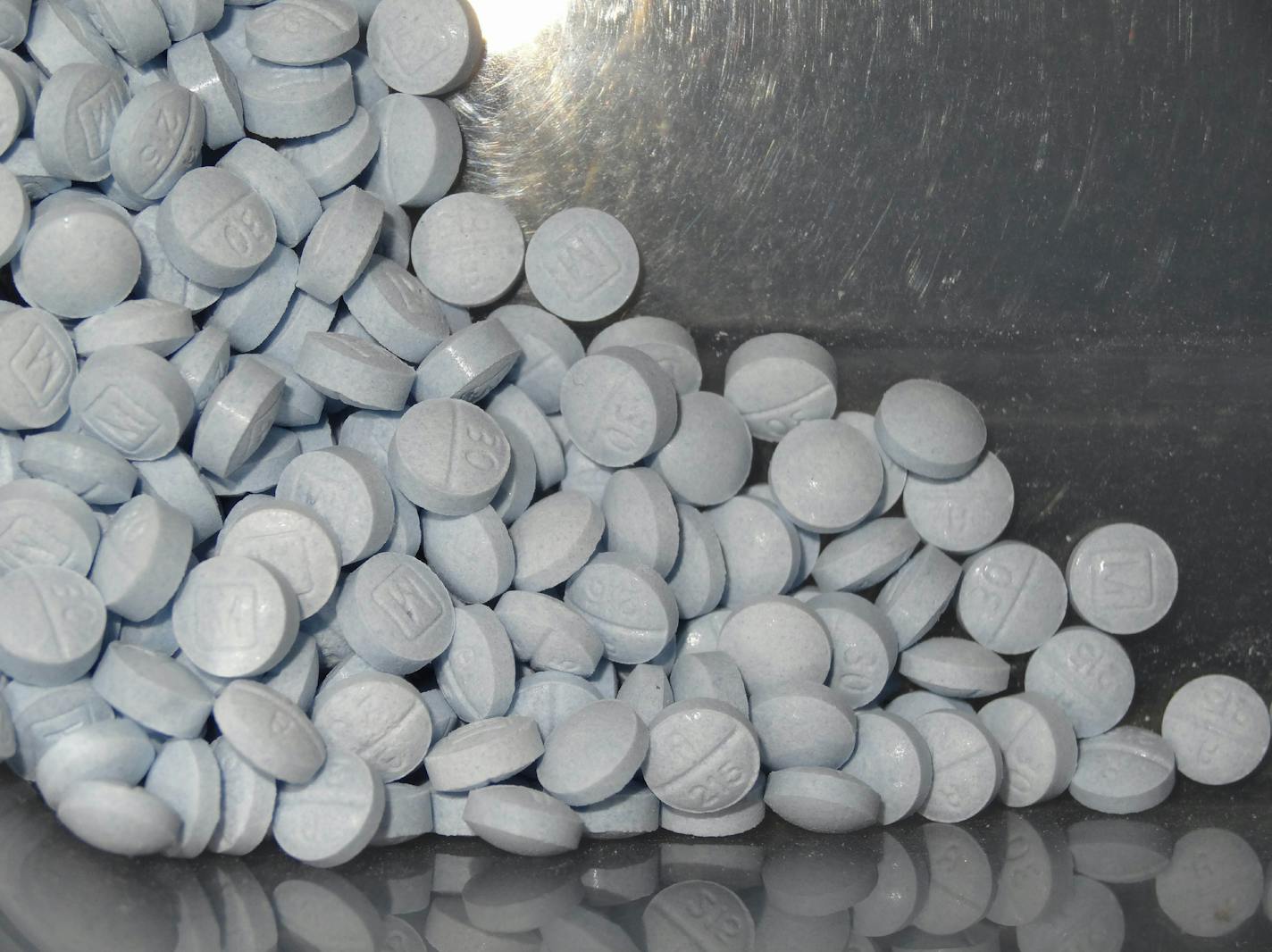 FILE - This undated file photo provided by the U.S. Attorneys Office for Utah and introduced as evidence at a trial shows fentanyl-laced fake oxycodone pills collected during an investigation. Accidental overdoses contribute to 90 percent of all U.S. opioid-related deaths. Rising use of illicitly manufactured and highly potent synthetic opioids including fentanyl has likely contributed to the unintentional death rate, which surged nine-fold between 2000 and 2017, the study found. (U.S. Attorneys