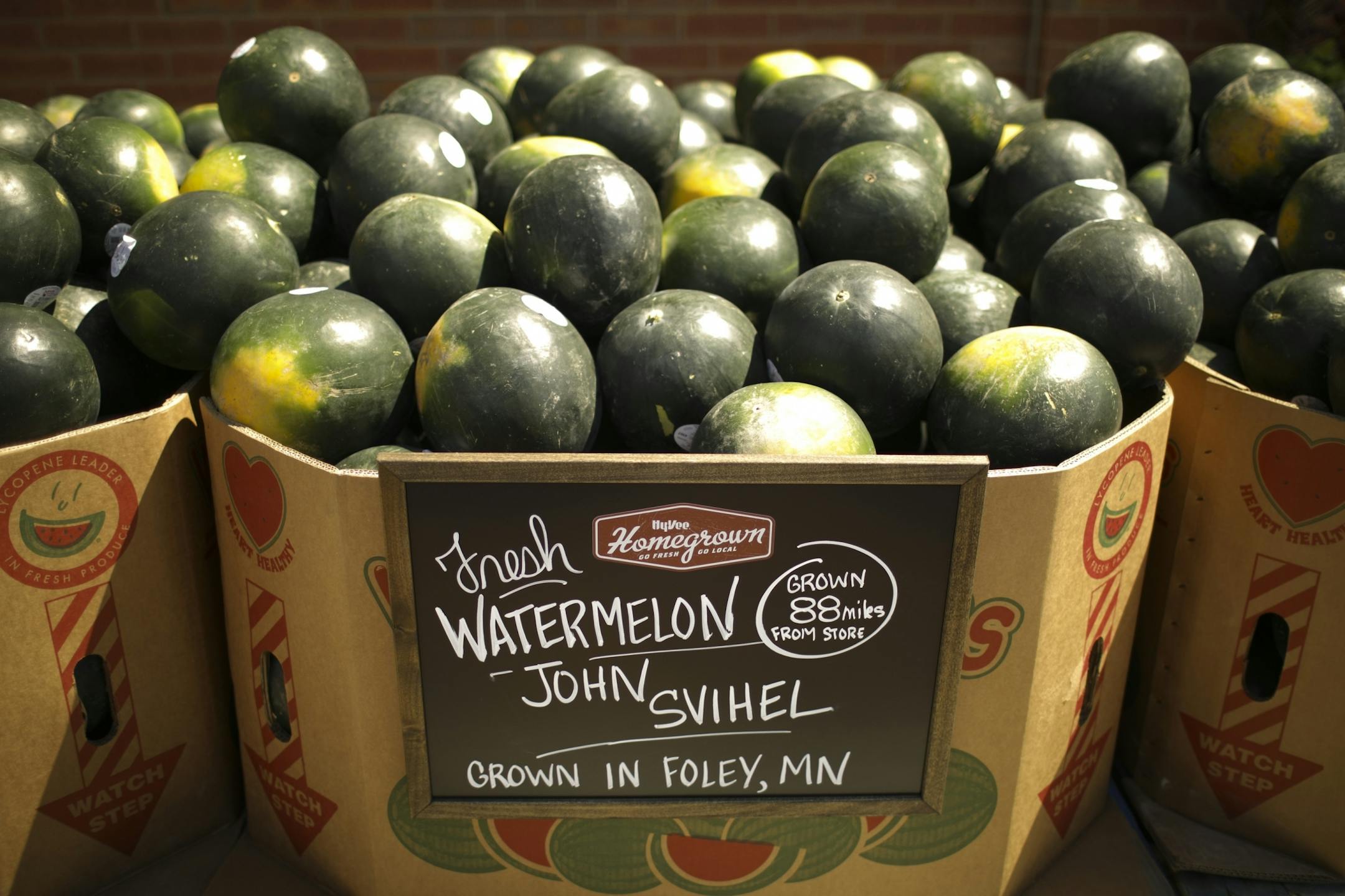 The local source of watermelons was touted on a display outside the new Hy-Vee store in Cottage Grove Monday afternoon.