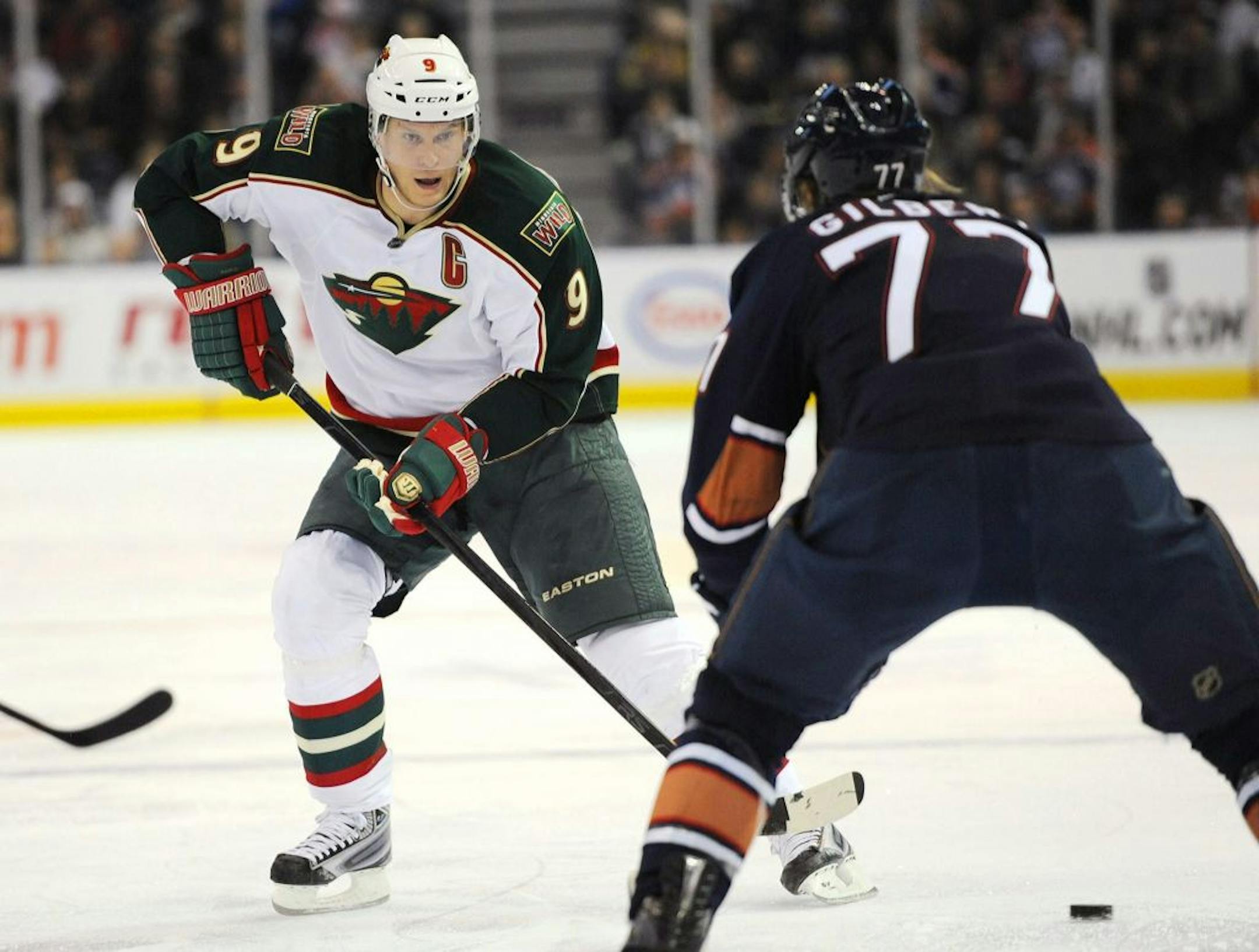 Wild center Mikko Koivu (left)