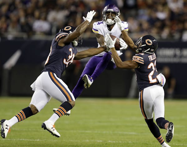 Chicago Bears strong safety Adrian Amos (38) and cornerback Kyle Fuller (23) break up a pass intended for Minnesota Vikings wide receiver Stefon Diggs