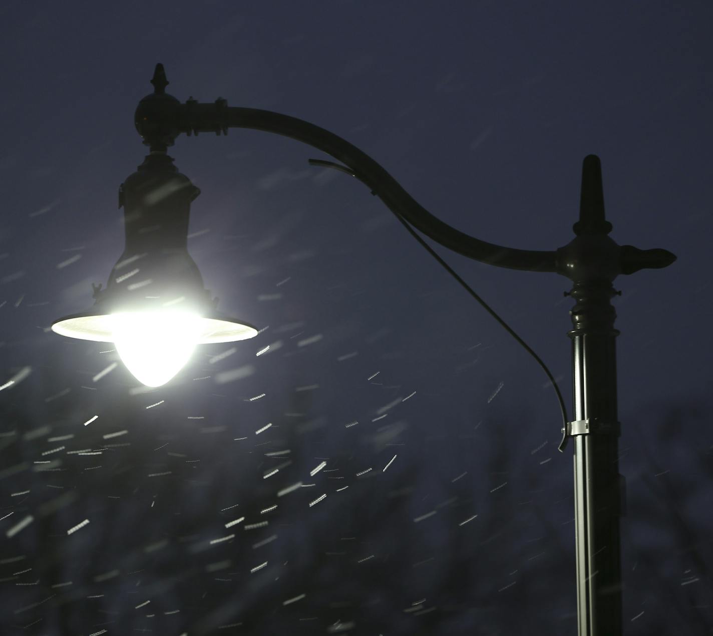 A Minneapolis parkway light fixture on E. Lake of the Isles Parkway at W. 22nd St. in a light snowfall.