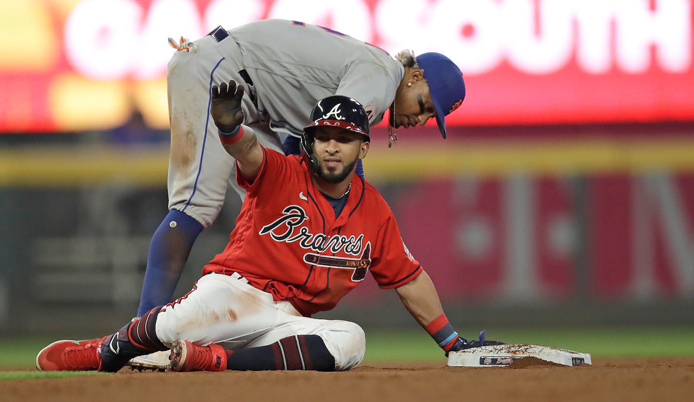 Atlanta Braves' Eddie Rosario celebrates after hitting a double against the New York Mets in the eighth inning of a baseball game Friday, Oct. 1, 2021, in Atlanta. (AP Photo/Ben Margot)