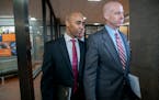 Former Minneapolis police officer Mohamed Noor, left, and his attorney Thomas Plunkett made their way out of court at the Hennepin County Government C