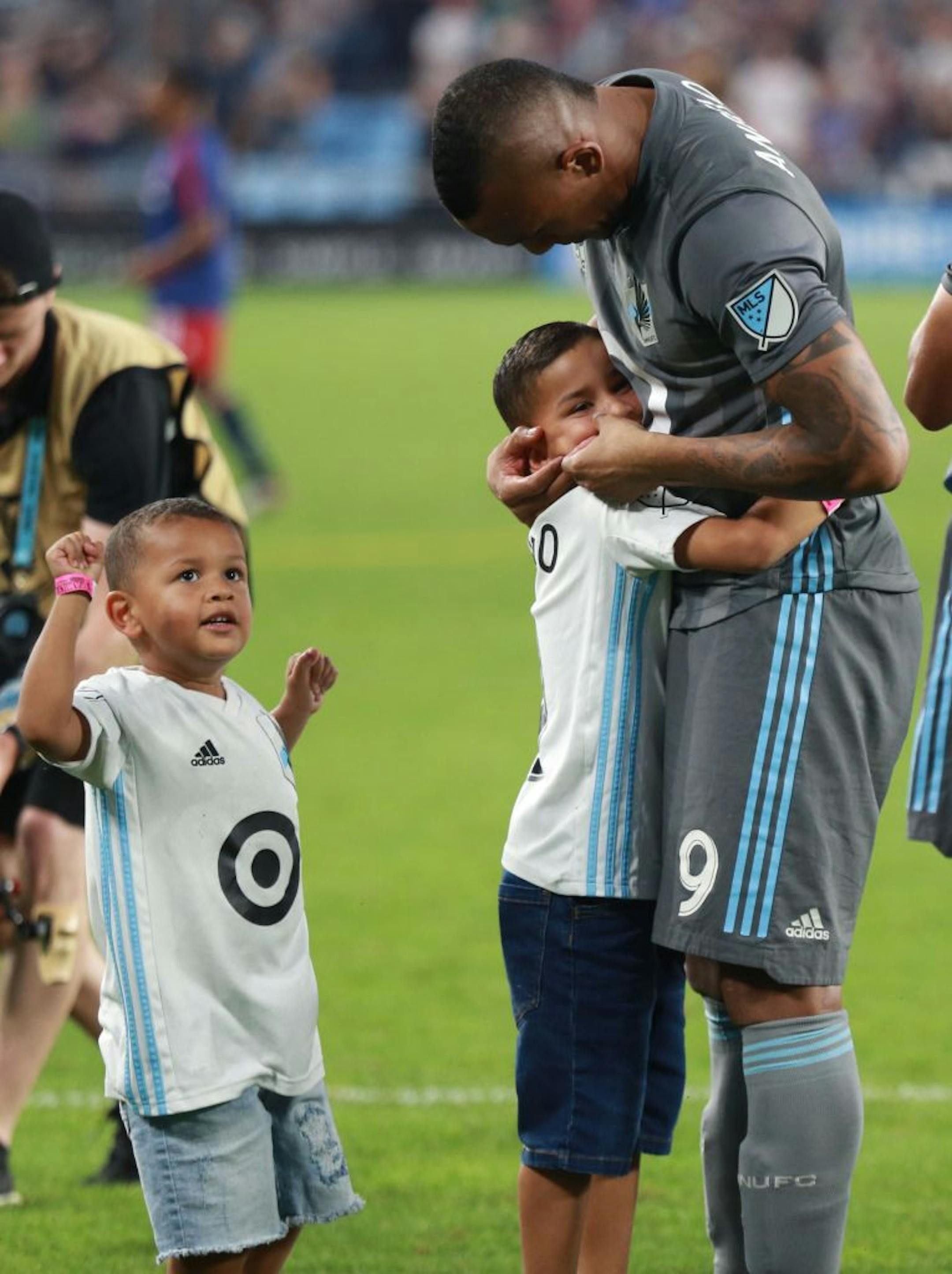 Angelpo Rodriguez (9) hugs his children after a stunning 1-0 win. ALEX KORMANN ¥ alex.kormann@startribune.com The Minnesota United FC took on FC Dalls on Saturday July 13, 2019 at Allianz Field in St. Paul, MN.