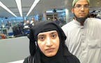 This July 27, 2014 photo provided by U.S. Customs and Border Protection shows Tashfeen Malik, left, and Syed Farook, as they passed through O'Hare Int