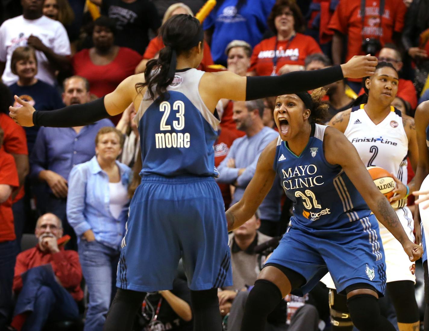 Minnesota Lynx forward Maya Moore (23) celebrates with Minnesota Lynx forward Rebekkah Brunson (32) after making the game winning three point shot at the buzzer during the fourth quarter. ] KYNDELL HARKNESS kyndell.harkness@startribune.com / BACKGROUND INFORMATION: During game three of the WNBA Finals at Bankers Life Field House in Indianapolis on Friday, October 9, 2015.