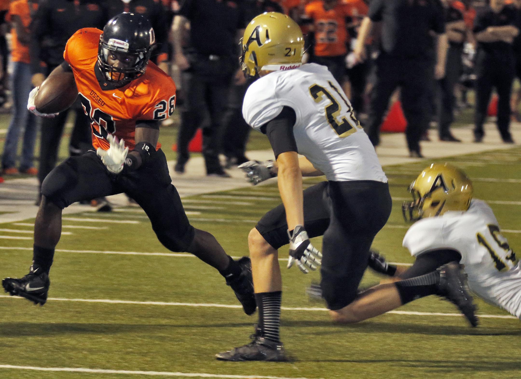 Andover vs. Osseo prep football. Osseo running back George Foley (26) helped set up an Osseo touchdown as he picked up rushing yards in the first half. Andover's Evan Olson (21) made the tackle. (MARLIN LEVISON/STARTRIBUNE(mlevison@startribune.com) ORG XMIT: MIN1309272045494477