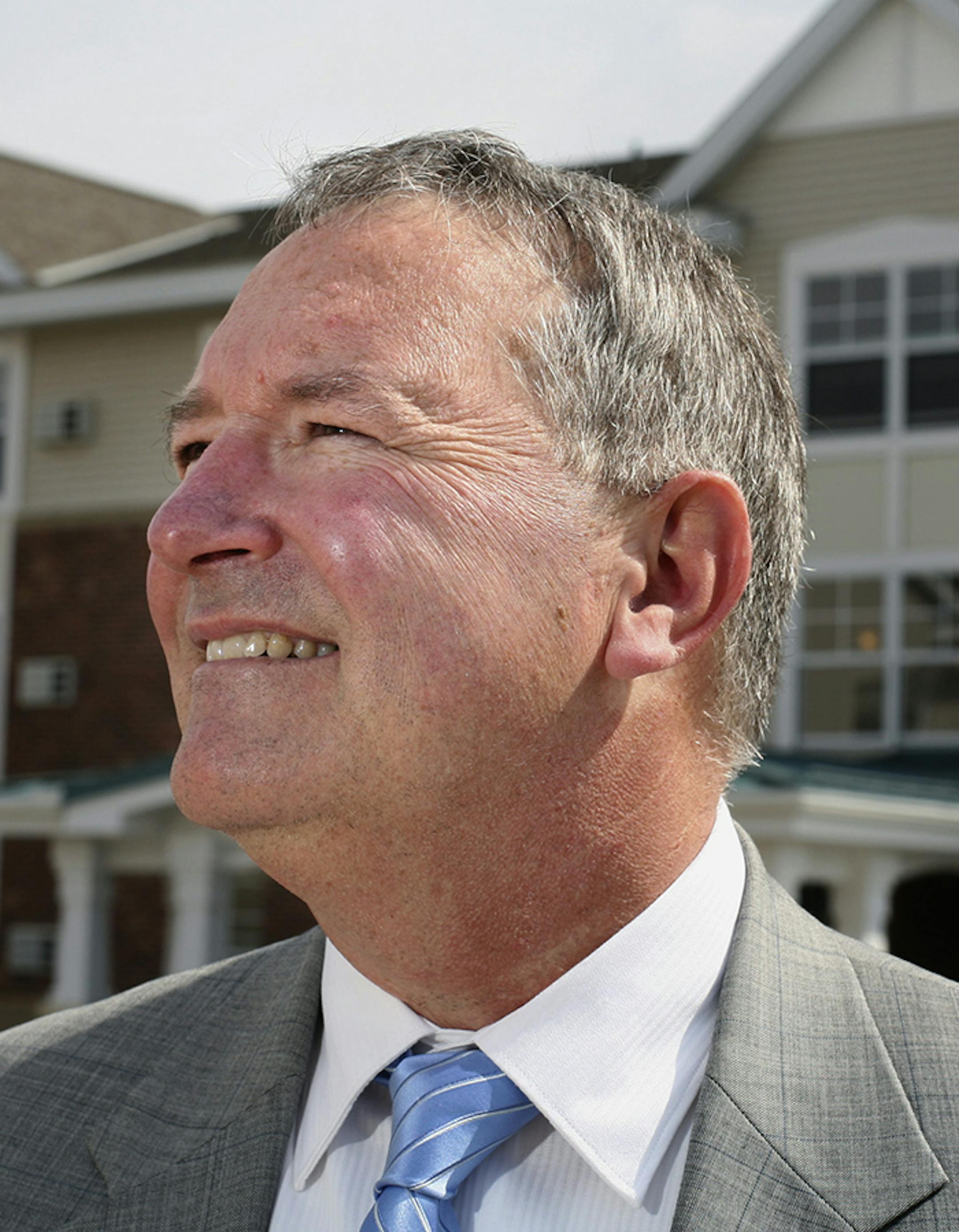 Dakota County Community Development Agency executive director Mark Ulfers show in front of Lakeside Pointe, one of the agency's senior housing developments in Eagan. ] GENERAL INFORMATION: JENNIFER SIMONSON ‘ jsimonson@startribune.com Eagan, MN-Thurs., Apr. 13, 2005 A mini-profile of Mark Ulfers, director of the Dakota County Community Development Agency. ORG XMIT: MIN2015031817061256