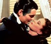 This image released by Turner Classic Movies shows Clark Gable, left, and Vivien Leigh in a scene from "Gone with the Wind." On Thursday, the TCM Clas