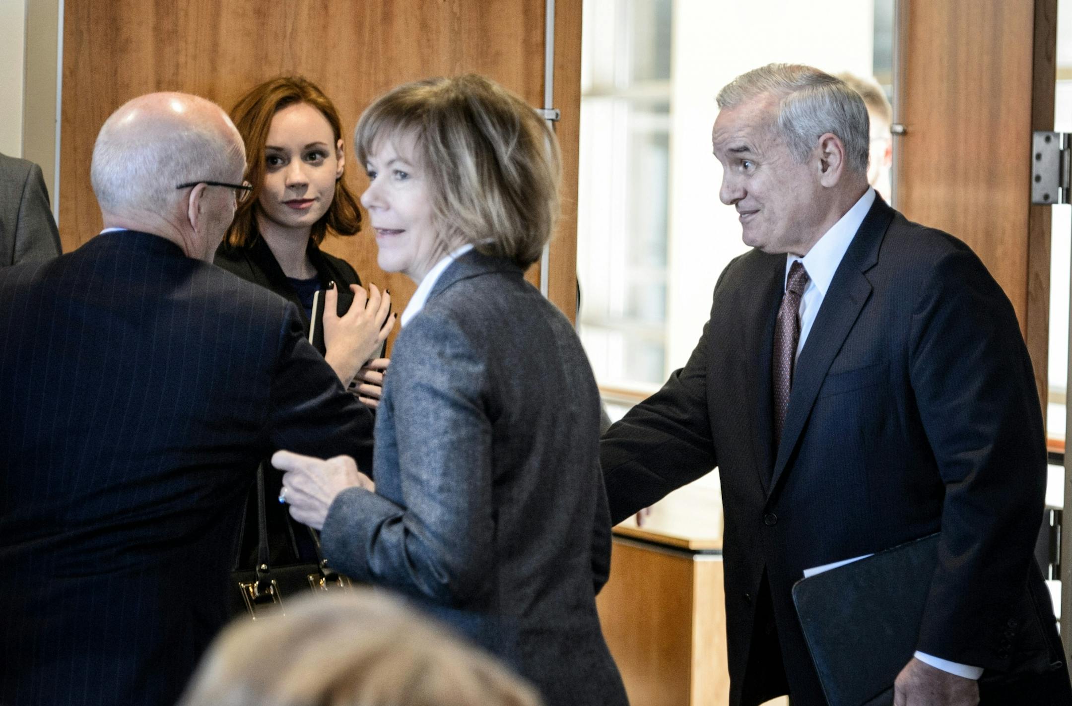 Governor Dayton shook hands with Minnesota Management and Budget Commissioner Myron Frans and praised his work on the budget forecast. In the center is Lt. Governor Tina Smith.