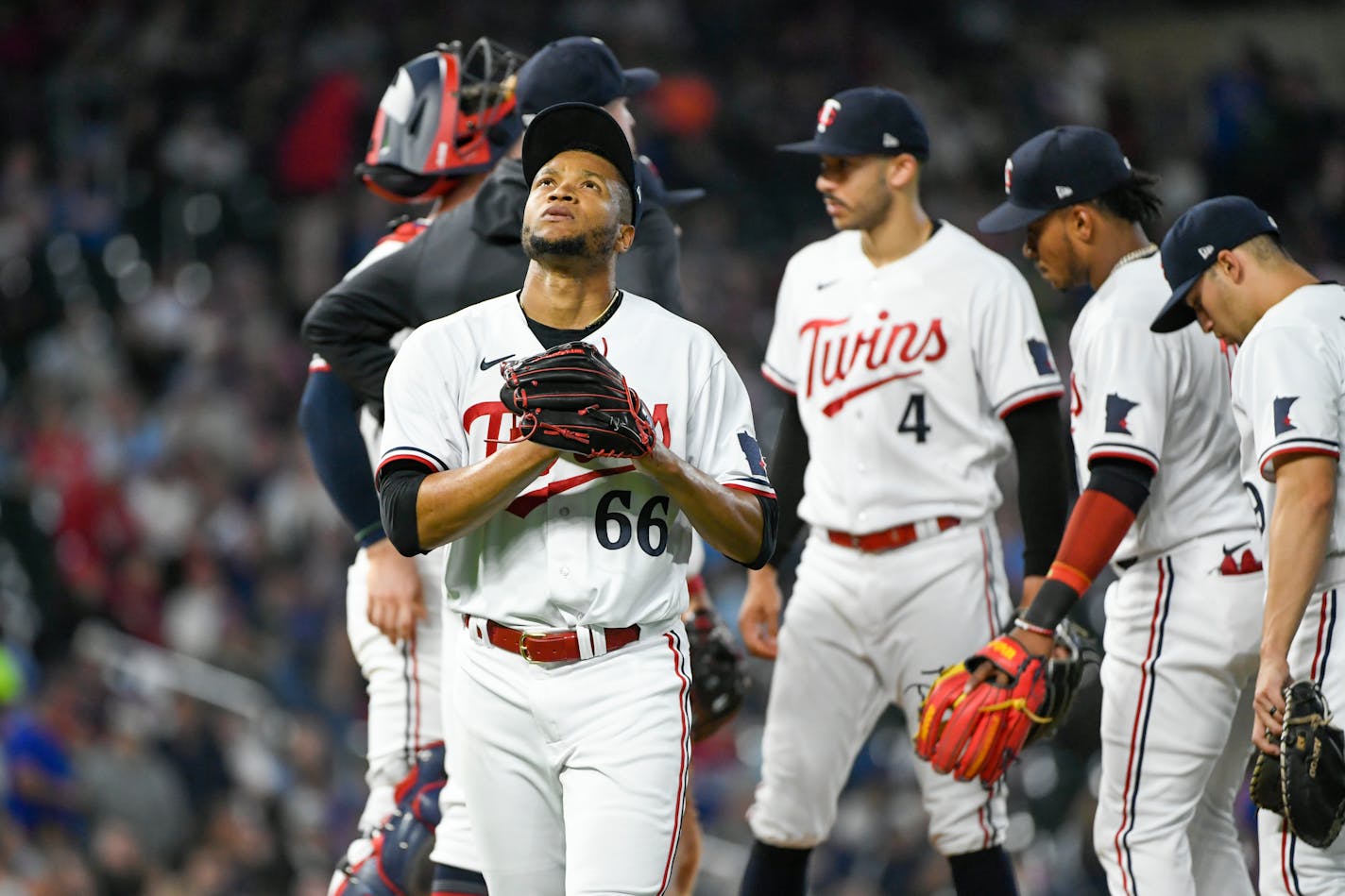 Twins pitcher Jorge Alcala heads to the dugout after giving up a two-run home run against the Cubs during the ninth inning Friday