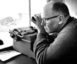 October 8, 1961 Sports information director for the university, Otis J. Dypwick, keeps close tab on the play on the field in order to help furnish sta