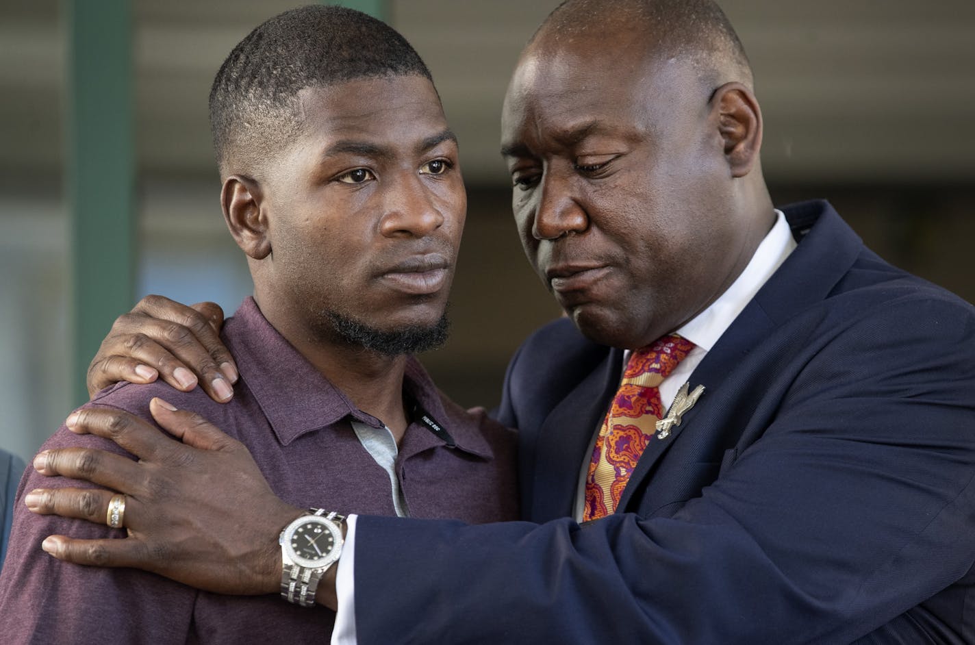 Quincy Mason (son of George Floyd) and attorney Benjamin Crump during a press conference in Minneapolis on Wednesday.