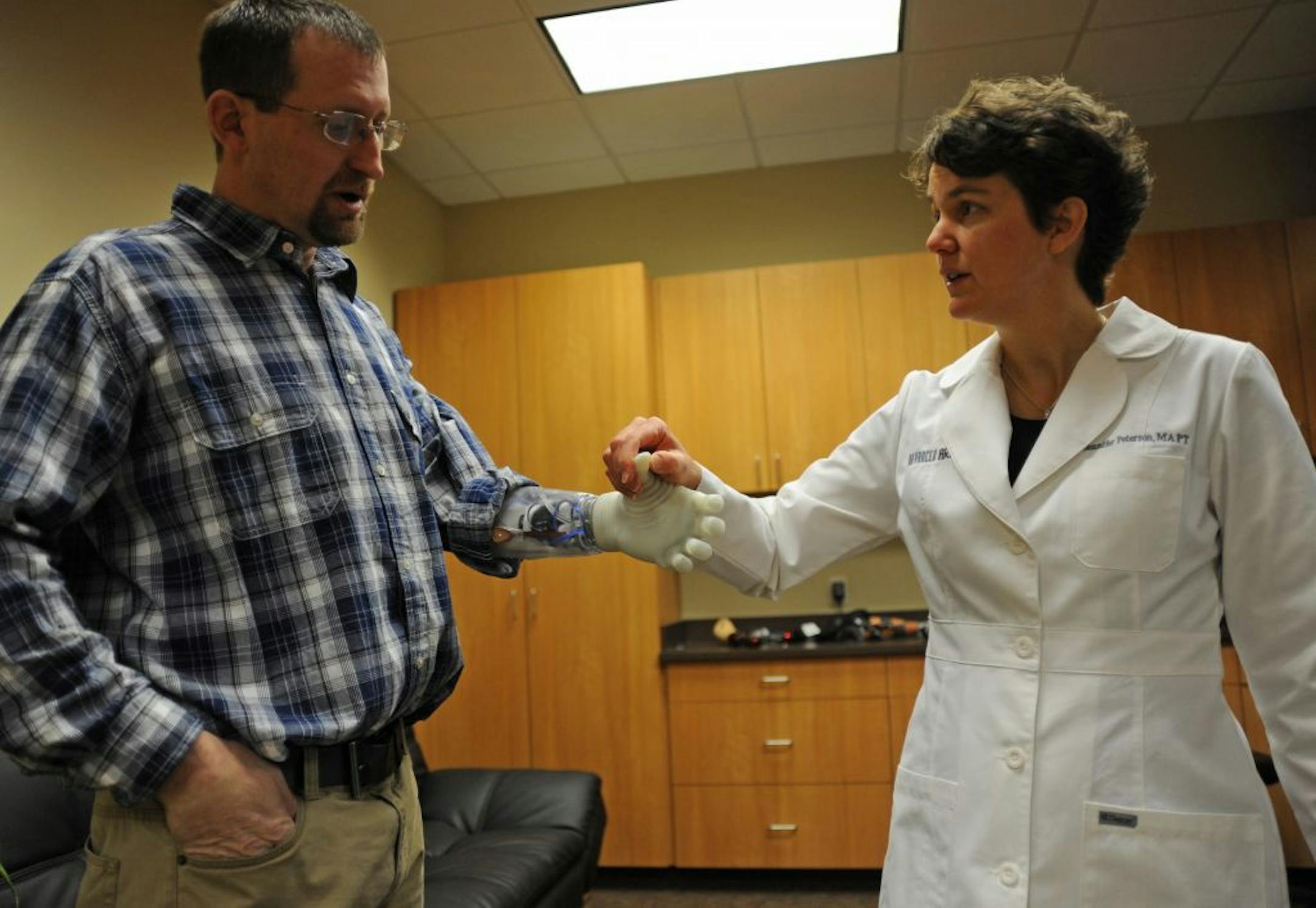Matt Razink of Medford, Wisc. received his his prosthetic hand yesterday, from Advanced Arm Dynamics in Maple Grove, Minn. and has begun the orientation and training for his new hand. He worked with Jennifer Peterson rehab co-ordinator. Advanced Arm Dynamics helped research a new type of prosthetic hand that has an electric opposable thumb. Razink is the first civilian to receive the product, which is valued at $100,000