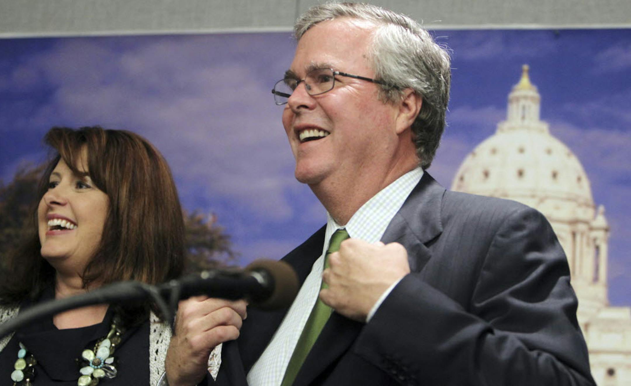 Jeb Bush has become an advocate for close oversight of teacher performance, and he supports merit pay and vouchers. Next to Bush during his appearance in St. Paul was Senate Majority Leader Amy Koch.
