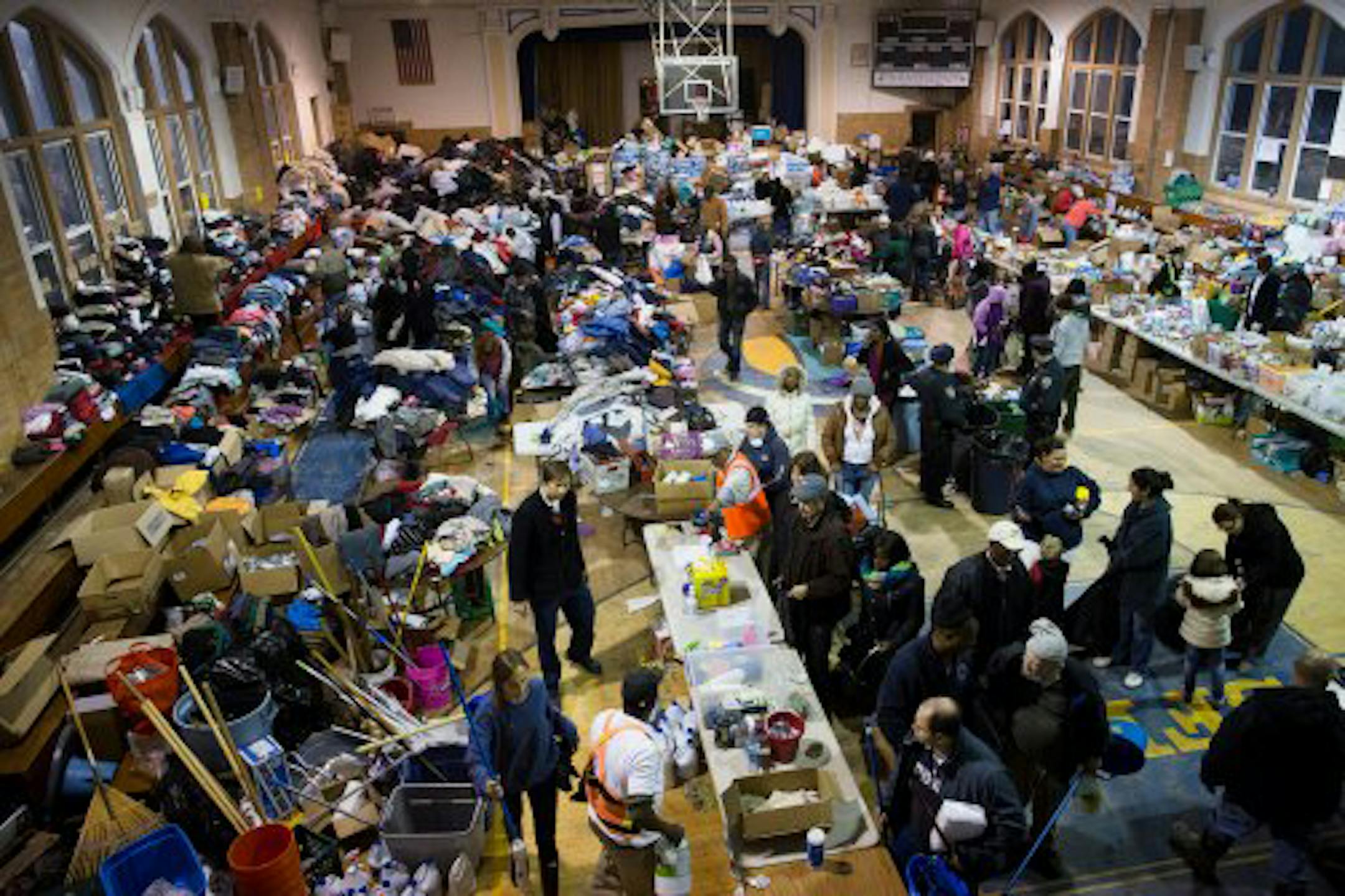 St. Francis de Sales Catholic Parish of Rockaway Park, N.Y., is the center of hurricane relief areas for the community. People come for clothes and other assistance in the school gymnasium.