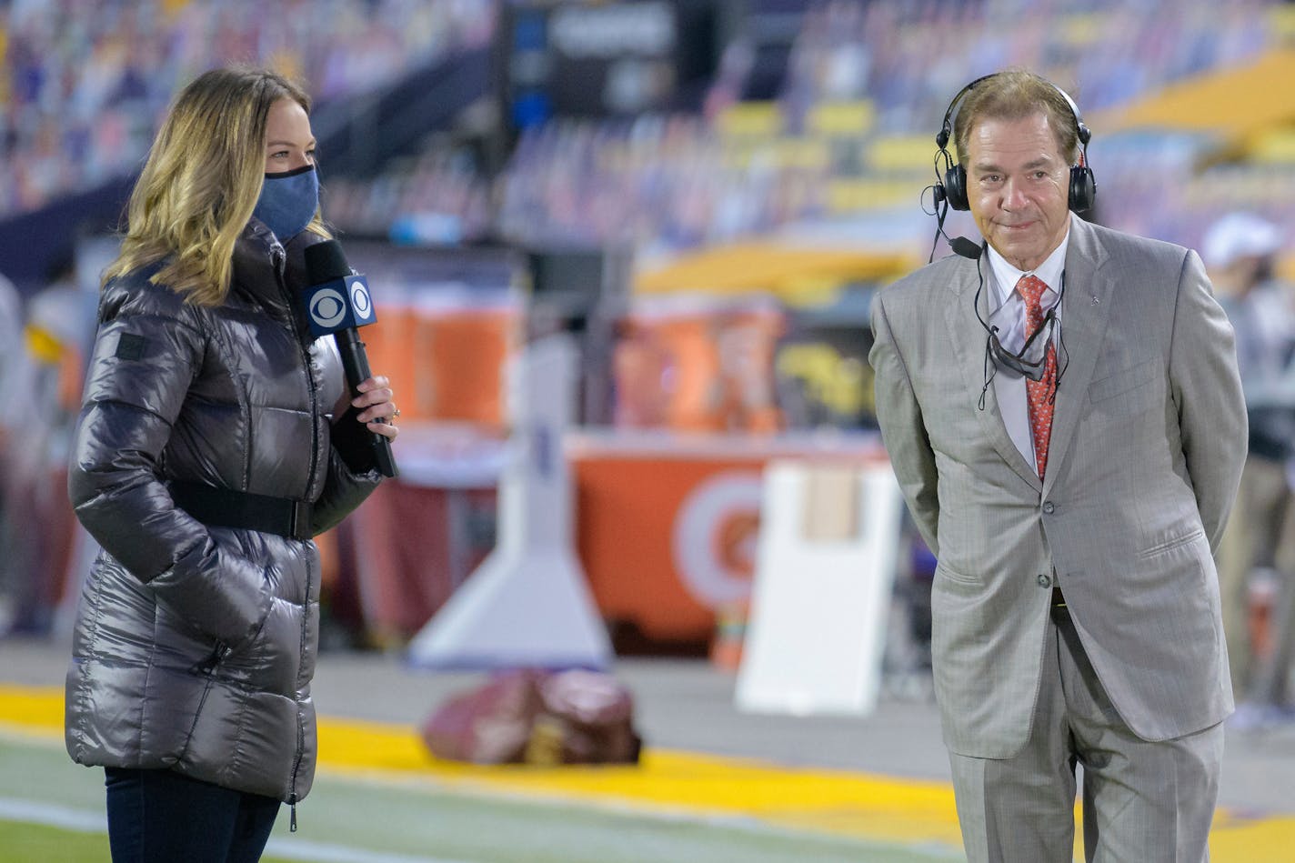 CBS Sports sideline reporter Jamie Erdahl interviews Alabama head coach Nick Saban before an NCAA college football game against LSU in Baton Rouge, La., Saturday, Dec. 5, 2020. (AP Photo/Matthew Hinton)