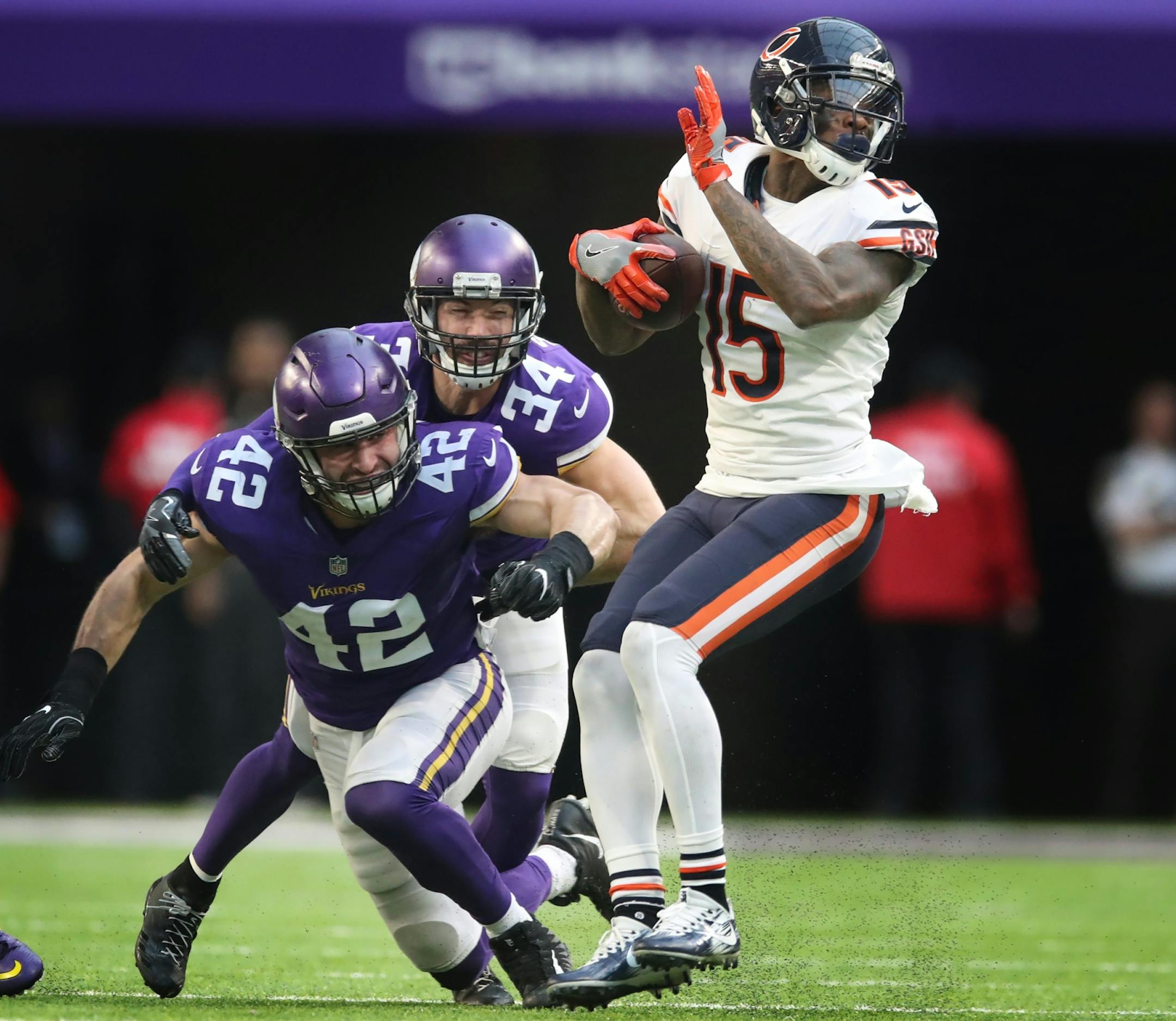Chicago Bears wide receiver Josh Bellamy (15) caught a pass in front of Minnesota Vikings outside linebacker Ben Gedeon (42) and strong safety Andrew Sendejo (34) in the fourth quarter at U.S. Bank Stadium Sunday December 31, 2017 in Minneapolis, MN.