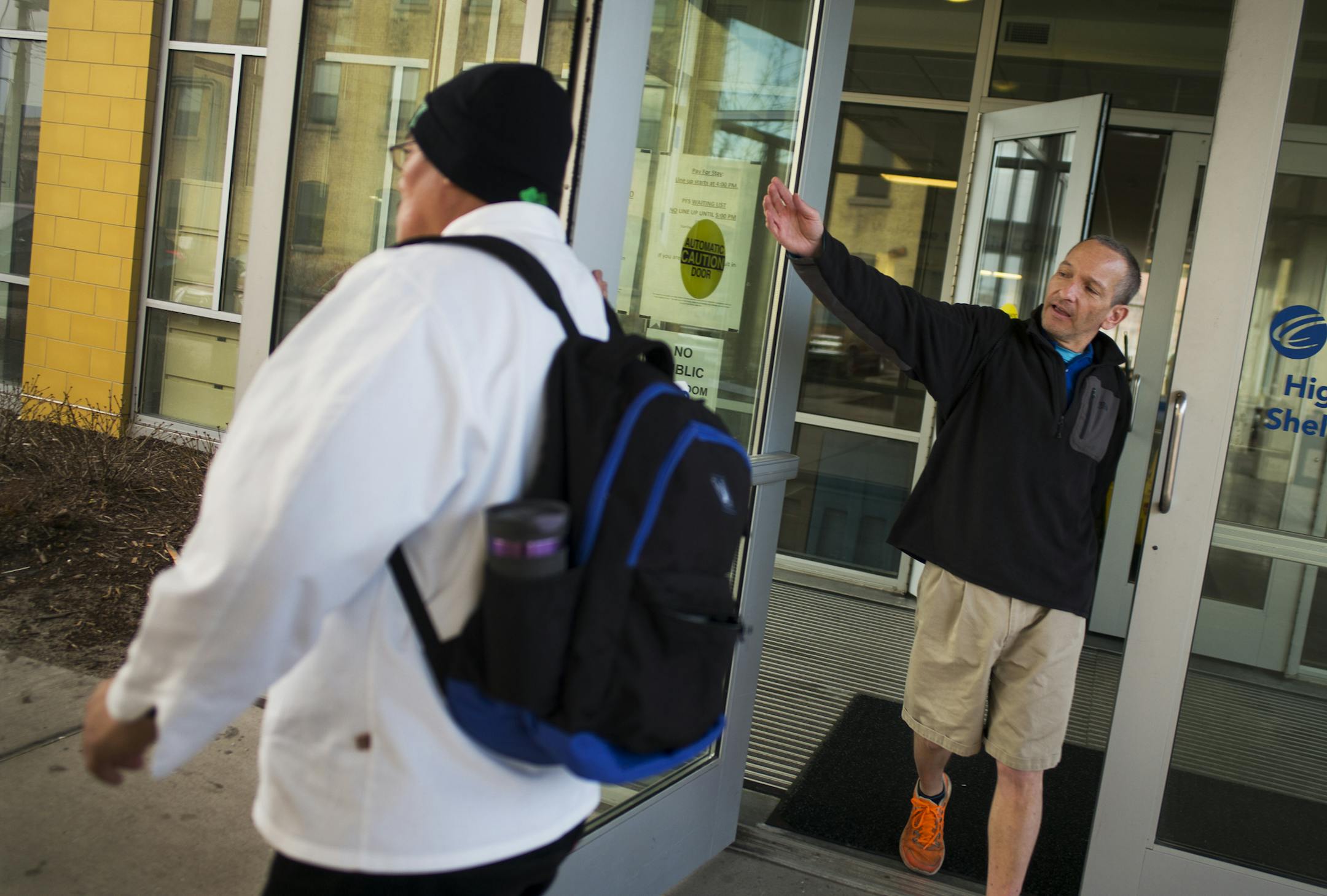 At the Higher Ground Catholic Charities shelter, Emmanuel Taintingfong,left, and Dave Baker, right leave the shelter at their own timetable around 8:34 a.m. Upstairs residents like themselves don't have to be out until 10 a.m. because of new funding .]Richard Tsong-Taatarii/rtsong-taatarii@startribune.com