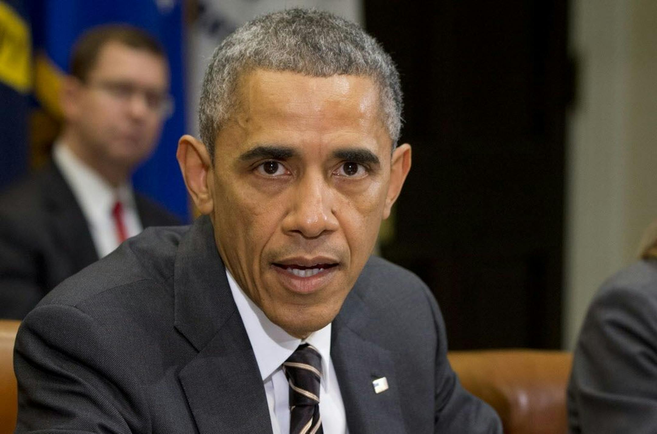 FILE - In this Dec. 12, 2014 file photo, President Barack Obama speaks in the Roosevelt Room of the White House in Washington.