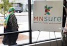 A woman walked past the Briva Health enrollment office for MNsure, Minnesota's insurance marketplace, in Minneapolis on Oct. 26. Briva Health is MNsur