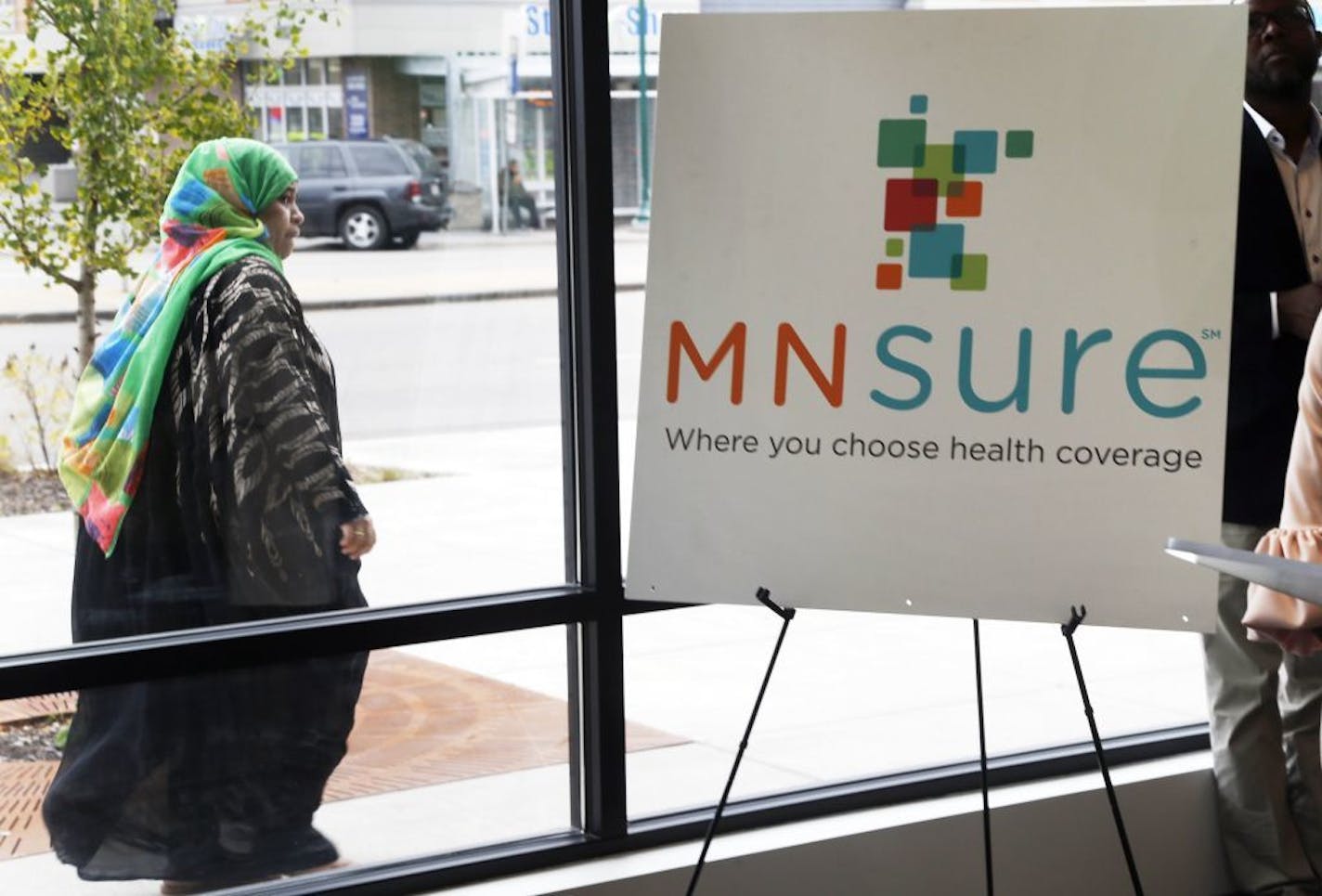 A woman walked past the Briva Health enrollment office for MNsure, Minnesota's insurance marketplace, in Minneapolis on Oct. 26. Briva Health is MNsure's largest enrollment partner.