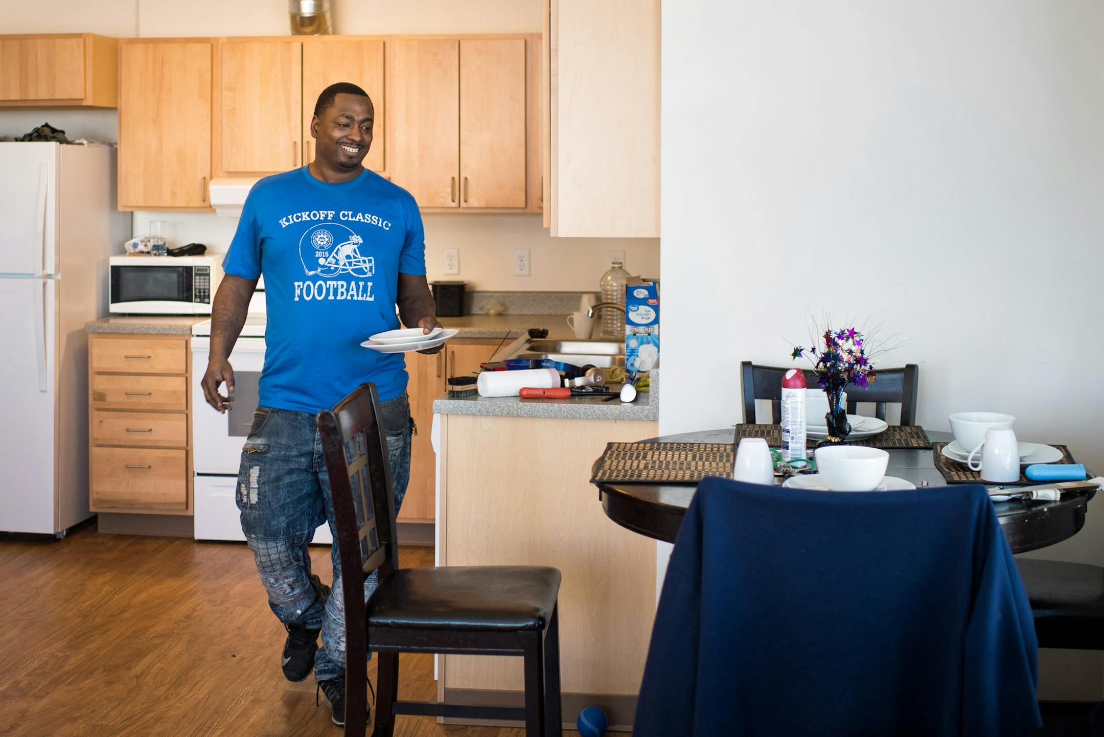 Detrick Cheairs, above, said he and his 7-year-old daughter, De'Liyah, "are so blessed" to have moved into Minneapolis' Hawthorne EcoVillage.