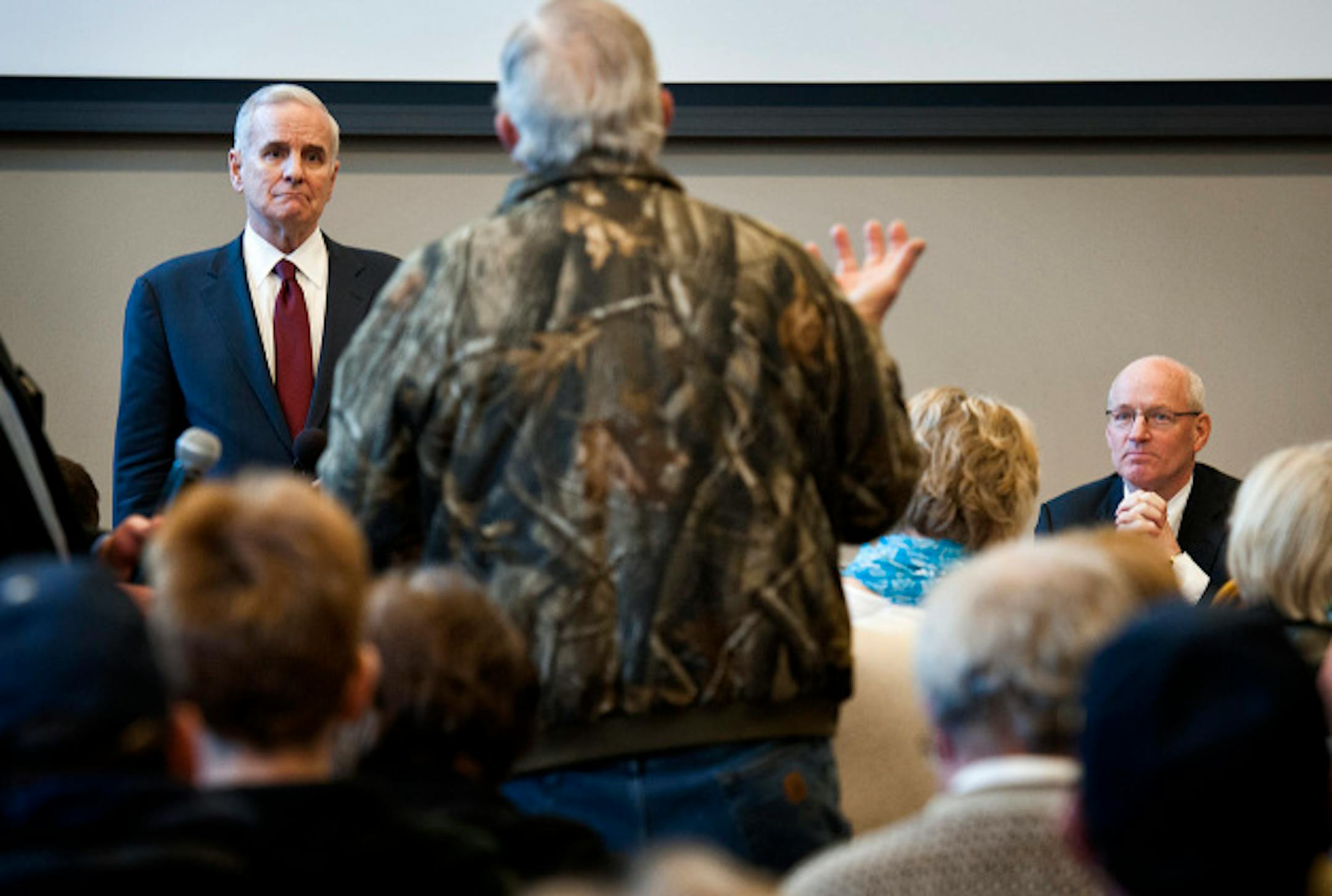 Governor Mark Dayton took questions from a standing room only crowd of a couple hundred people in his first 'Meeting with Mark' in a town hall meeting in Duluth to talk about his budget proposal.   Wednesday, March 20, 2013. With him on the right is Revenue Commissioner Myron Frans.   ]   GLEN STUBBE * gstubbe@startribune.com