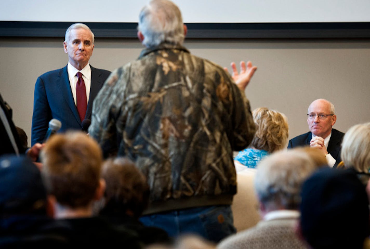 Governor Mark Dayton took questions from a standing room only crowd of a couple hundred people in his first 'Meeting with Mark' in a town hall meeting in Duluth to talk about his budget proposal.   Wednesday, March 20, 2013. With him on the right is Revenue Commissioner Myron Frans.   ]   GLEN STUBBE * gstubbe@startribune.com