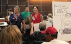 More than 100 people packed the St. Louis Park council chambers Monday night to protest a decision to do away with the Pledge of Allegiance at most me
