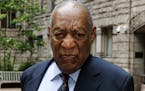 Bill Cosby pauses in the courtyard of the Allegheny County Courthouse as one of his attorneys makes a statement to the media, as they arrive for the t