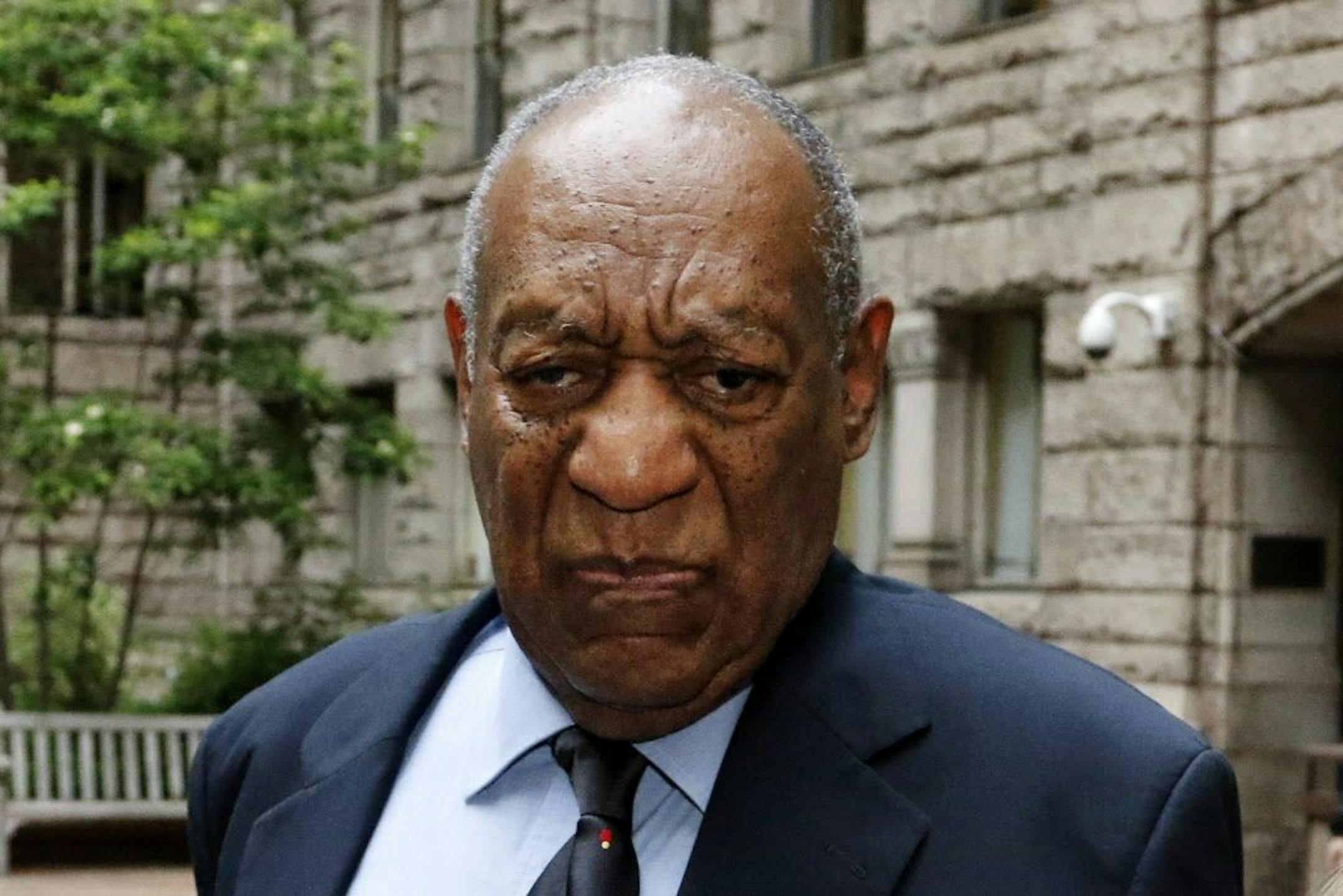 Bill Cosby pauses in the courtyard of the Allegheny County Courthouse as one of his attorneys makes a statement to the media, as they arrive for the third day of jury selection in his sexual assault case, Wednesday, May 24, 2017, in Pittsburgh. The case is set for trial June 5 in suburban Philadelphia.