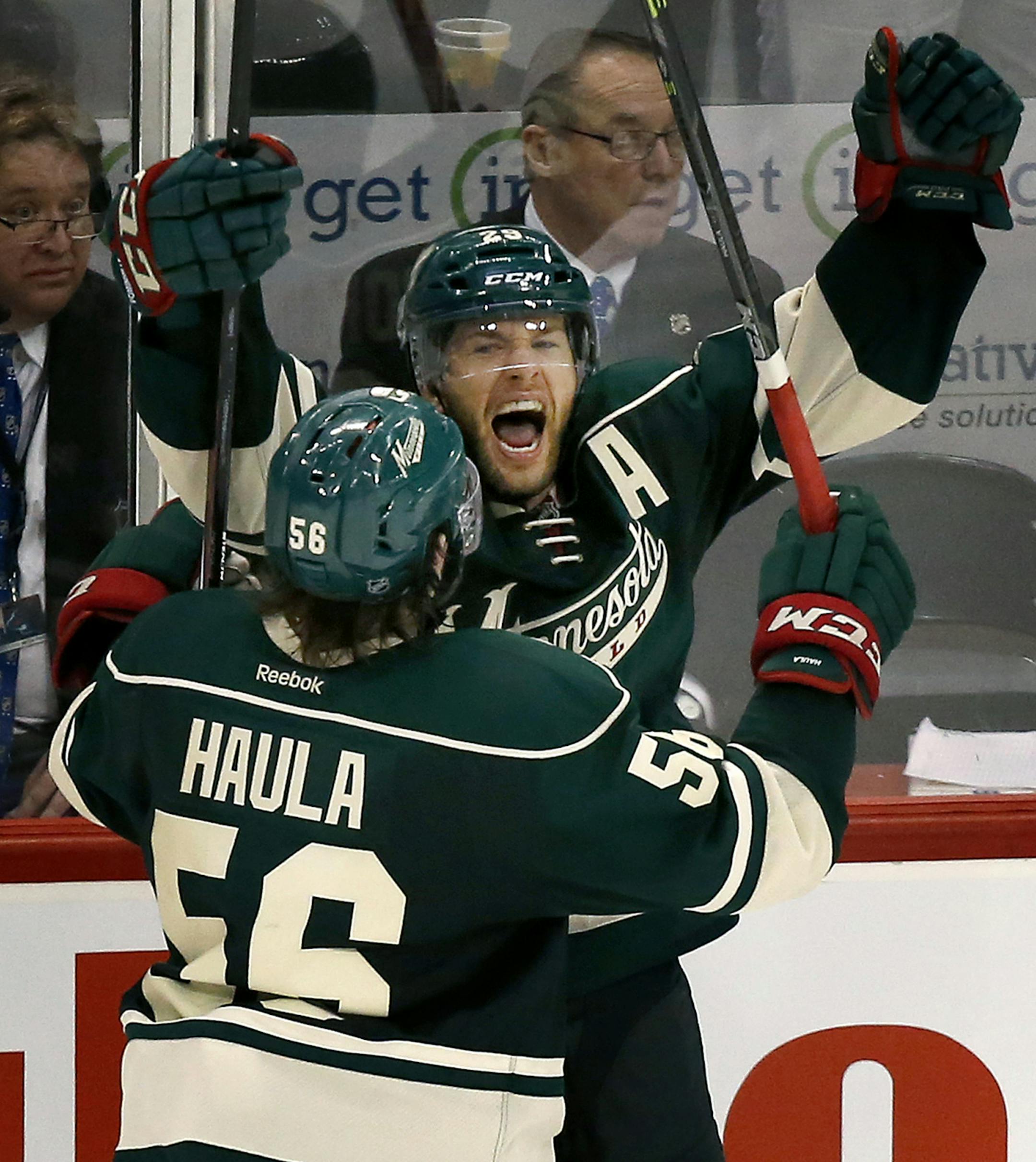 Jason Pominville and Erik Haula (56) celebrated an empty net goal by Pominville in the third period. ] CARLOS GONZALEZ cgonzalez@startribune.com - April 18, 2016, St. Paul, MN, Xcel Energy Center, NHL, Hockey, Minnesota Wild vs. Dallas Stars, First Round Stanley Cup Playoffs, Game 3 ORG XMIT: MIN1604182235003503