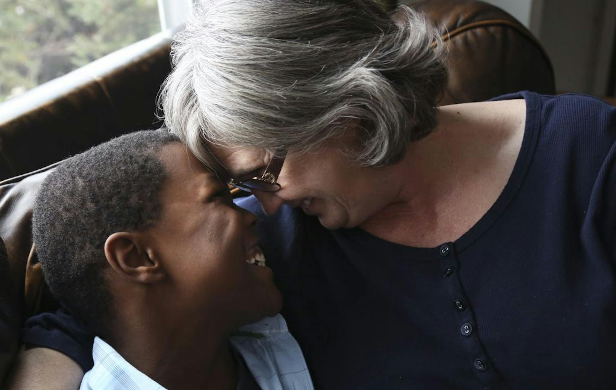 Ezekiel Hassing, 10, and mom Teresa. After Ezekiel exhibited behavioral problems, the Hopkins family got help from Washburn Center for Children in Minneapolis