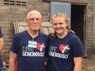 At 87, Orin Scandrett went to a remote village in Cambodia to build houses for the poor. At right is 18-year-old Hannah Anfinrud, the trip's youngest 