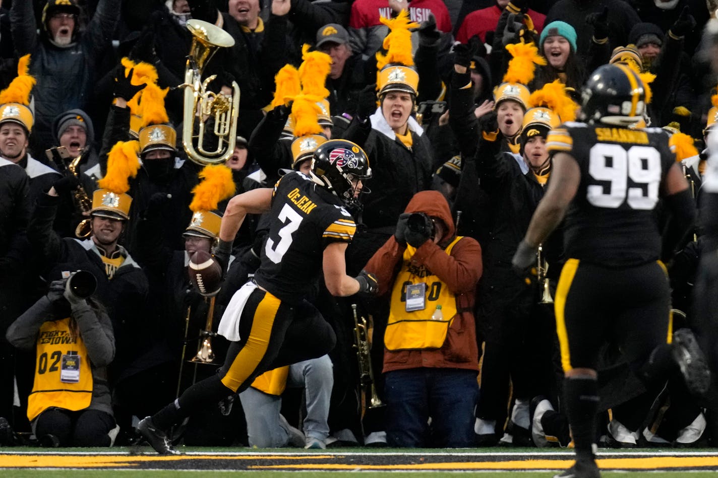 Iowa defensive back Cooper DeJean (3) celebrates after returning an interception for a touchdown during the first half of an NCAA college football game against Wisconsin, Saturday, Nov. 12, 2022, in Iowa City, Iowa. (AP Photo/Charlie Neibergall)