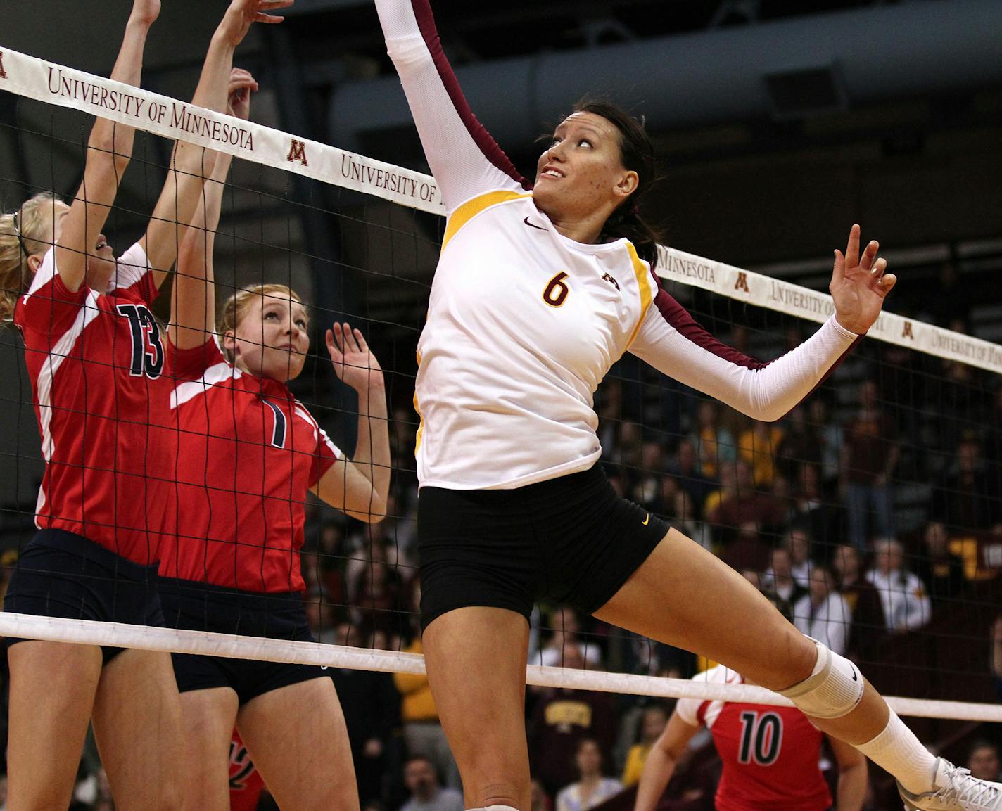 Minnesota's Tori Dixon scrambled to place the ball over the net in the third period. ] MARISA WOJCIK - The University of Minnesota women's vollyball team played the Liberty Flames on Friday, November 30, 2012 at the Sports Pavilion in Minneapolis. ORG XMIT: MIN1211302059500250