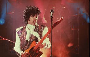 Prince performs in his debut movie "Purple Rain," the 1984 rock opera about a young man's search for artistic accomplishment and love. (AP Photo) ORG