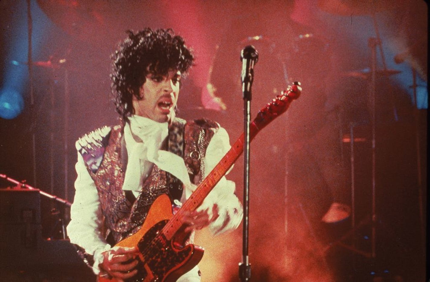 Prince performs in his debut movie "Purple Rain," the 1984 rock opera about a young man's search for artistic accomplishment and love. (AP Photo) ORG XMIT: MIN2013070317435669