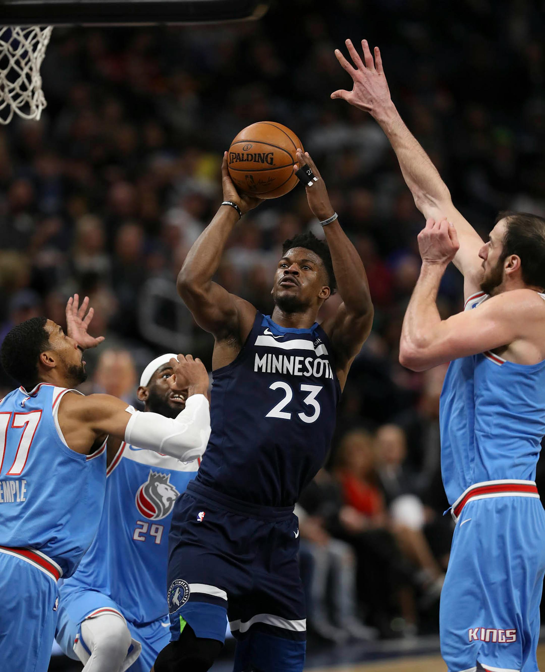 Minnesota Timberwolves guard Jimmy Butler (23) drove through the middle of three Kings defenders to take a fourth quarter shot. He finished the game with18 points. ] JEFF WHEELER • jeff.wheeler@startribune.com The Minnesota Timberwolves extended their home winning streak to a lucky 13 with their 111-106 win over the Sacramento Kings in an NBA basketball game Sunday evening, February 11, 2018 at Target Center in Minneapolis.