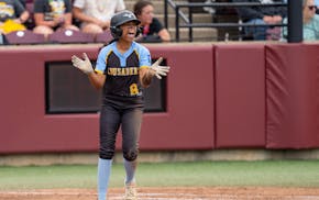 St. Cloud Cathedral’s Keira Alexander celebrates after scoring a run against Hawley the third inning of the Class 3A final Friday at Jane Sage Cowle