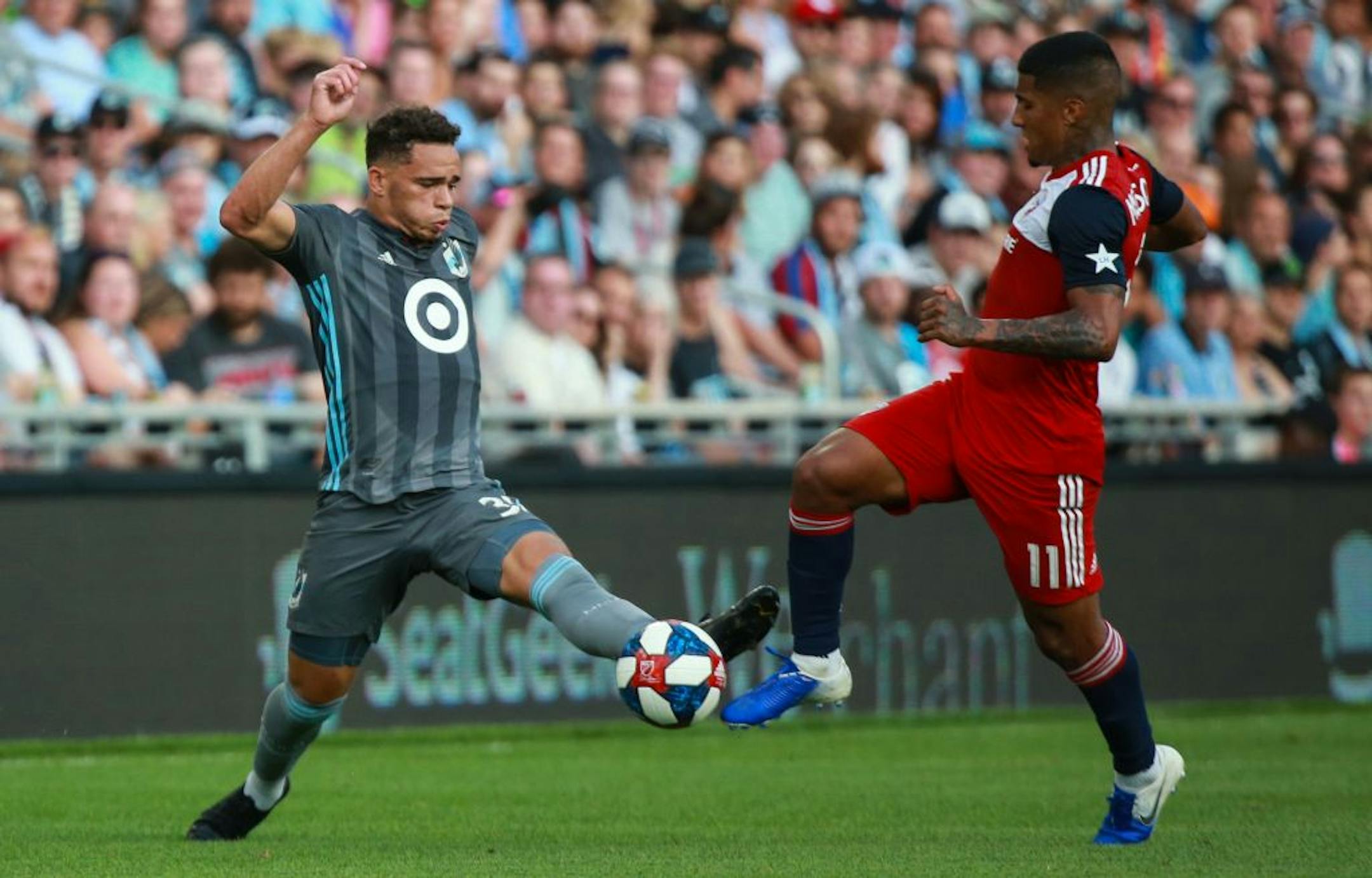 Minnesota FC midfielder Hassani Dotson (31) challengers FC Dallas midfielder Santiago Mosquera for a ball. ALEX KORMANN ¥ alex.kormann@startribune.com The Minnesota United FC took on FC Dalls on Saturday July 13, 2019 at Allianz Field in St. Paul, MN.