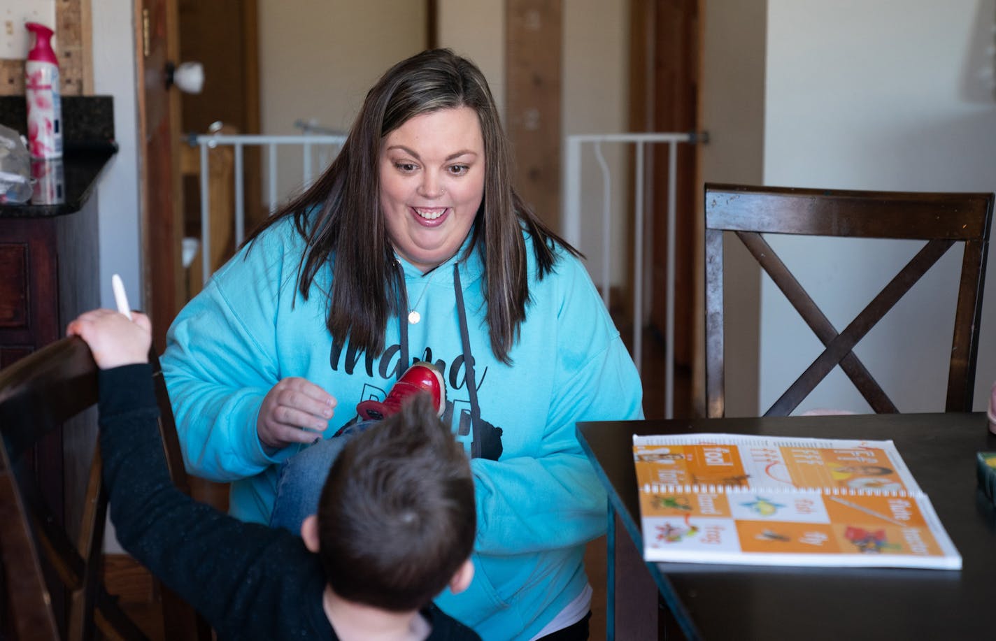 Emily Allen, a nurse who is working at Bethesda Hospital - which is handling COVID-19 cases - worked and played with her kids on her day off. Leo, 4, worked on letters of the alphabet, Lilly, 3 worked on numerals while Sully, 11 months watched and tried to join in. She told them if they studied, then they could go outside and do sidewalk chalk in the driveway. ] GLEN STUBBE &#x2022; glen.stubbe@startribune.com Wednesday, April 1, 2020