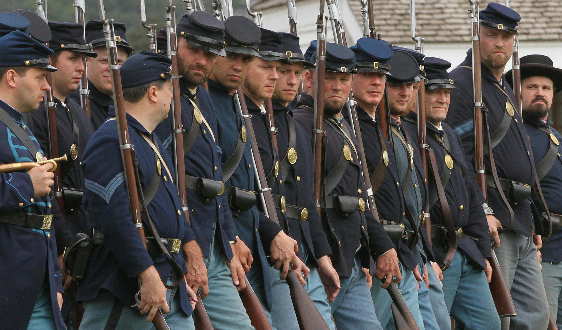 Members of the 1st Minnesota Volunteer Infantry marched in the parade field during a infantry drill and musket firing demonstration at Fort Snelling during the Civil War Weekend on 8/18/12. The First Regiment of Minnesota Volunteer Infantry is a non-profit organization founded in 1973 to honor the memory and teach the history of the civil war unit. The Fort Snelling weekend event allowed visitors to travel back to the 1860s and experience life at the frontier fort during the Civil War. Costumed